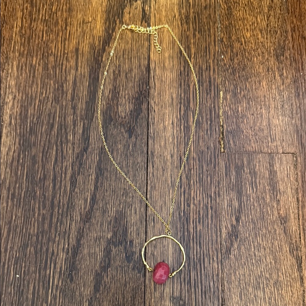 Unique gold necklace with pink stone